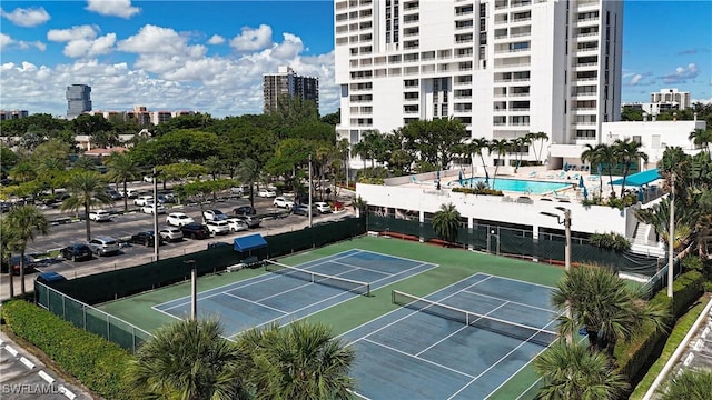 20225 NE 34th Ct, Miami, FL 33180 - view of tennis court with fence and a view of city