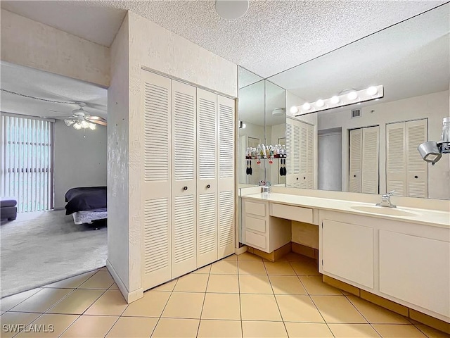 20225 NE 34th Ct, Miami, FL 33180 - bathroom featuring a textured ceiling, a closet, and tile patterned flooring