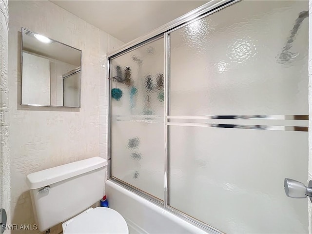 20225 NE 34th Ct, Miami, FL 33180 - full bath featuring combined bath / shower with glass door and toilet