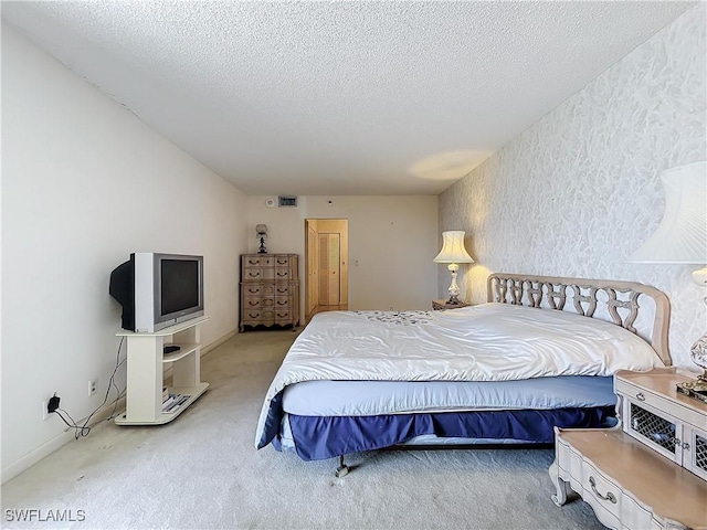 20225 NE 34th Ct, Miami, FL 33180 - bedroom featuring a textured ceiling, visible vents, and carpet