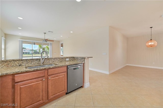10486 Winged Elm Ln, Fort Myers, FL 33913 - kitchen featuring stainless steel dishwasher, light stone countertops, brown cabinets, a ceiling fan, and recessed lighting