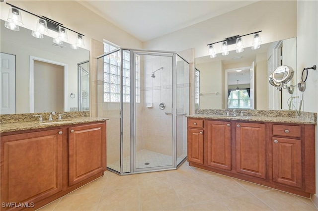 10486 Winged Elm Ln, Fort Myers, FL 33913 - bathroom with a stall shower, tile patterned flooring, and two vanities