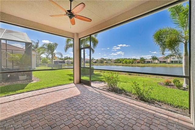 10486 Winged Elm Ln, Fort Myers, FL 33913 - unfurnished sunroom with a water view and a ceiling fan