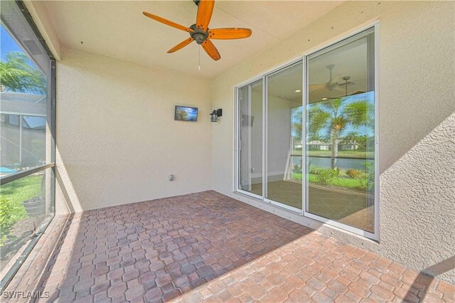 10486 Winged Elm Ln, Fort Myers, FL 33913 - unfurnished sunroom with a ceiling fan, a water view, and healthy amount of natural light