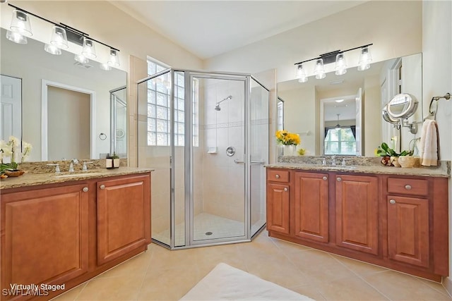 10486 Winged Elm Ln, Fort Myers, FL 33913 - full bathroom featuring a shower stall, tile patterned floors, and two vanities