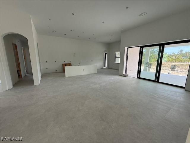 2481 24th Ave NE, Naples, FL 34120 - unfurnished living room with arched walkways