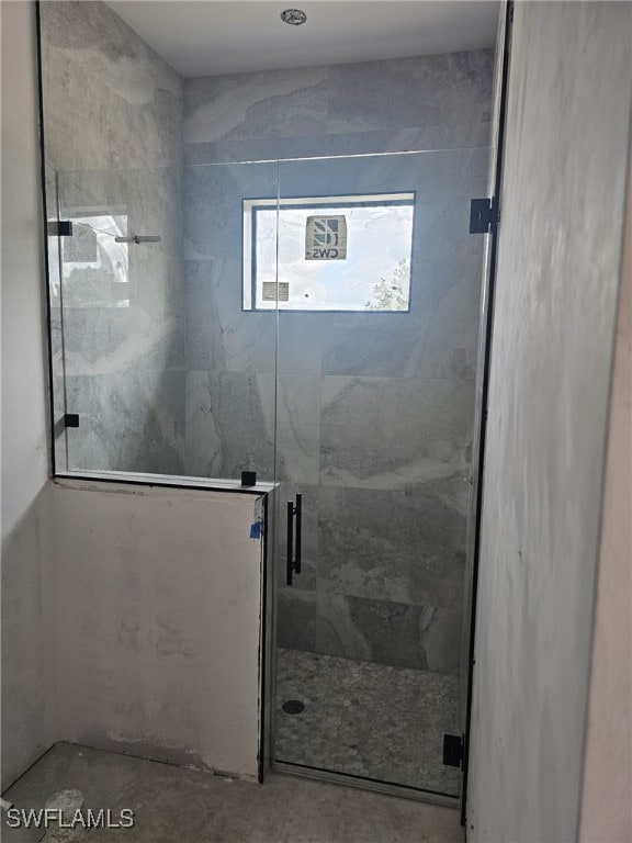2481 24th Ave NE, Naples, FL 34120 - full bathroom featuring a shower stall and unfinished concrete flooring