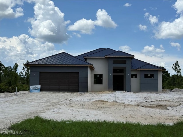 2481 24th Ave NE, Naples, FL 34120 - view of front facade with a metal roof and stucco siding