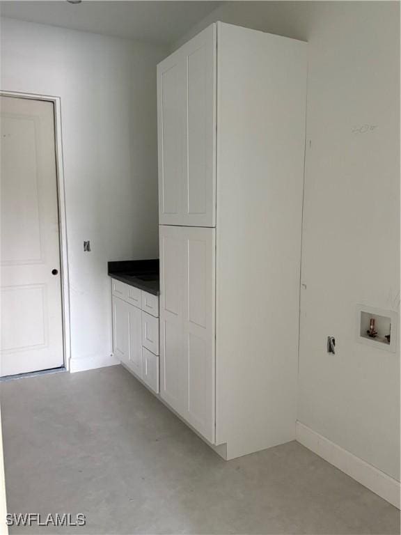 2481 24th Ave NE, Naples, FL 34120 - laundry area featuring cabinet space and washer hookup