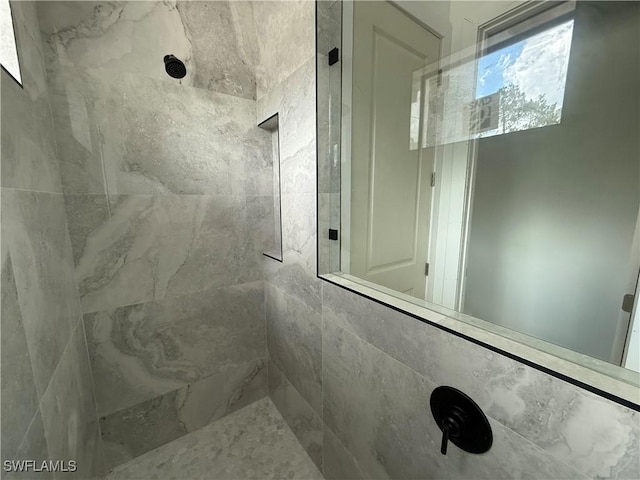 2481 24th Ave NE, Naples, FL 34120 - full bathroom featuring tiled shower