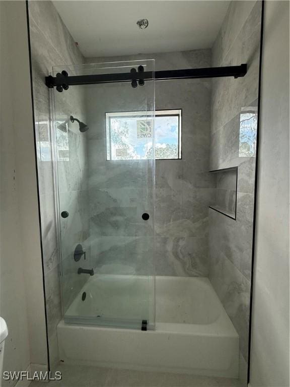2481 24th Ave NE, Naples, FL 34120 - bathroom with enclosed tub / shower combo and toilet