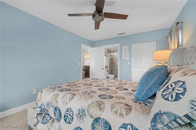 15030 Arbor Lakes Dr W Unit 201, North Fort Myers, FL 33917 - carpeted bedroom with visible vents, baseboards, a closet, a ceiling fan, and ensuite bath