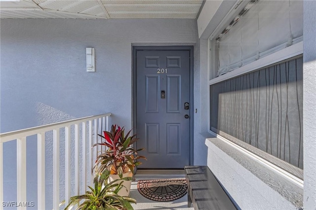 15030 Arbor Lakes Dr W Unit 201, North Fort Myers, FL 33917 - view of exterior entry with stucco siding