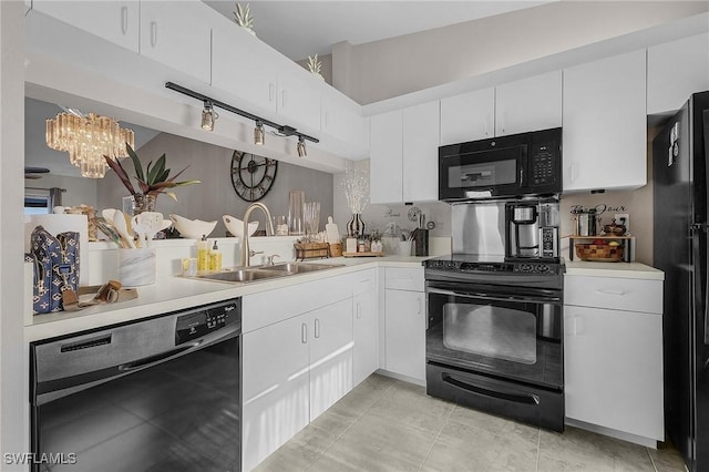15030 Arbor Lakes Dr W Unit 201, North Fort Myers, FL 33917 - kitchen with a sink, light countertops, black appliances, and a notable chandelier