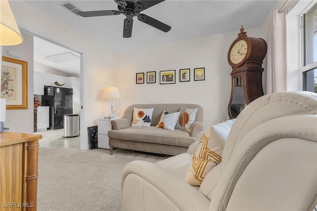15030 Arbor Lakes Dr W Unit 201, North Fort Myers, FL 33917 - living area featuring light carpet, a ceiling fan, and vaulted ceiling
