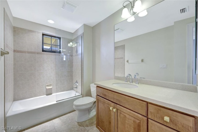 bathroom featuring visible vents, tile patterned flooring, toilet, and vanity