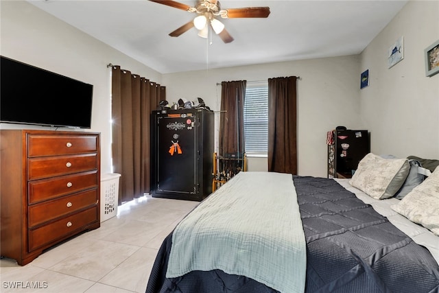 bedroom with light tile patterned floors and a ceiling fan