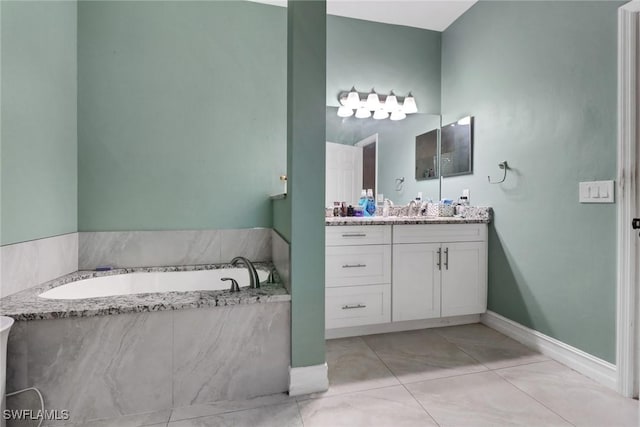 full bathroom featuring vanity and a garden tub