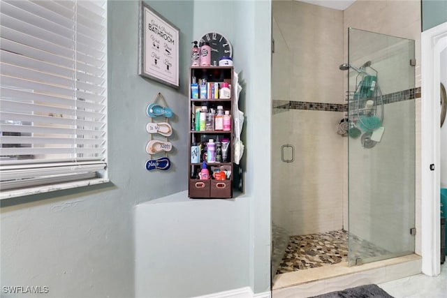 bathroom featuring a stall shower