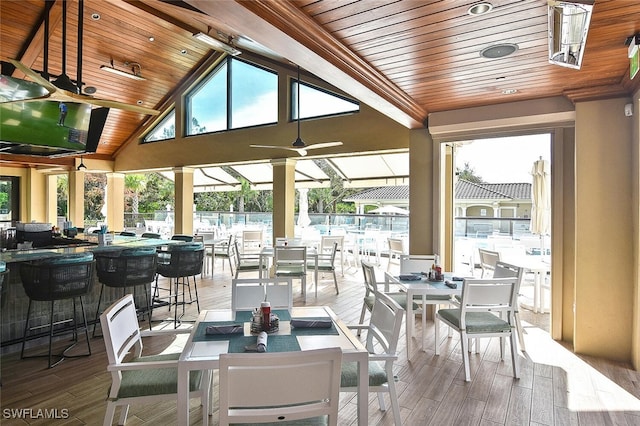 view of patio with outdoor dining space and a ceiling fan