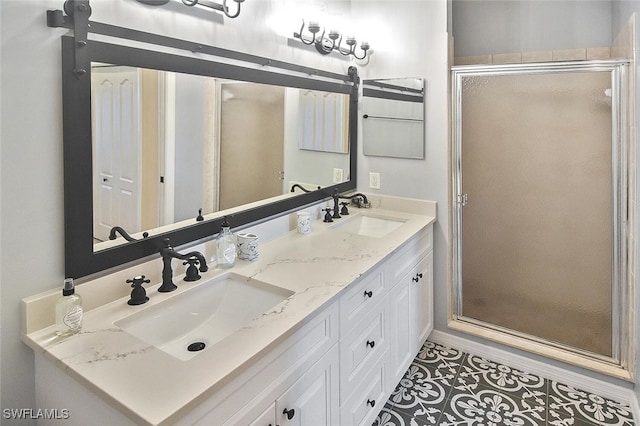 bathroom with a sink, a shower stall, and double vanity
