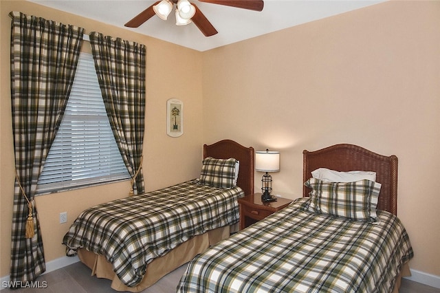 bedroom featuring baseboards and a ceiling fan
