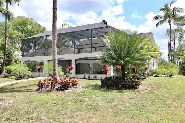 2061 Santa Barbara Blvd, Naples, FL 34116 - rear view of property with a lawn and glass enclosure