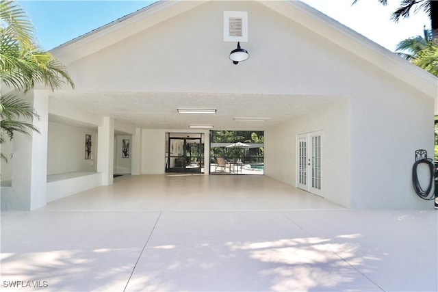 2061 Santa Barbara Blvd, Naples, FL 34116 - entrance to property featuring french doors, a carport, a patio area, and stucco siding