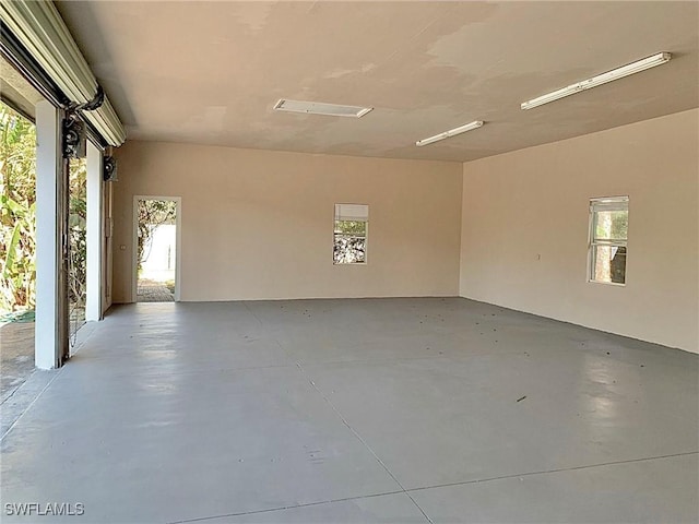 2061 Santa Barbara Blvd, Naples, FL 34116 - spare room with finished concrete flooring and healthy amount of natural light