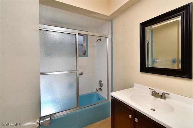 full bath with vanity and bath / shower combo with glass door