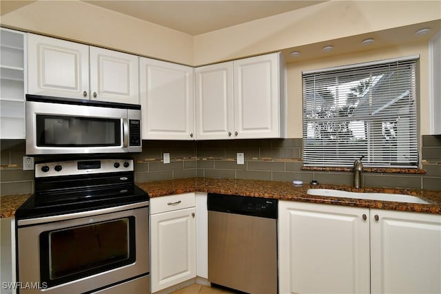 kitchen featuring a sink, white cabinetry, and appliances with stainless steel finishes