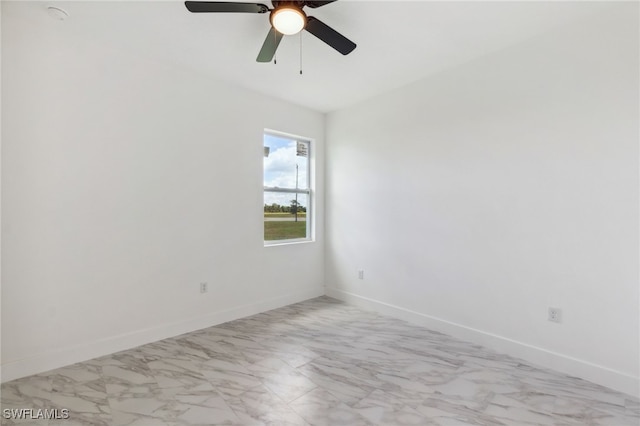 8 Cleat Ct, Placida, FL 33946 - unfurnished room featuring marble look tiles, ceiling fan, and baseboards