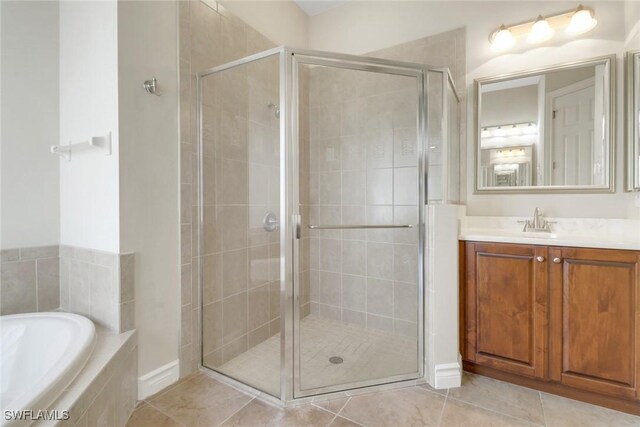 14070 Tivoli Ter, Bonita Springs, FL 34135 - full bathroom featuring a garden tub, tile patterned floors, a stall shower, and vanity