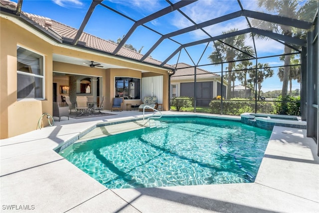 14070 Tivoli Ter, Bonita Springs, FL 34135 - view of swimming pool featuring a patio, ceiling fan, a pool with connected hot tub, and glass enclosure