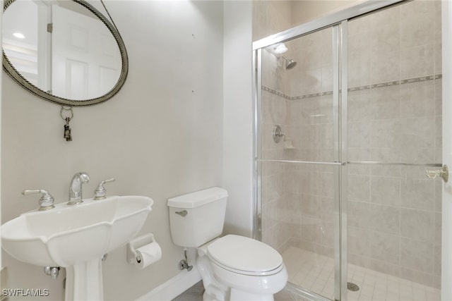 14070 Tivoli Ter, Bonita Springs, FL 34135 - full bathroom featuring a sink, baseboards, a stall shower, and toilet