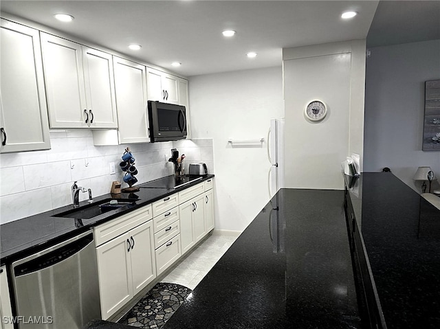 kitchen featuring black electric stovetop, stainless steel dishwasher, a sink, and recessed lighting