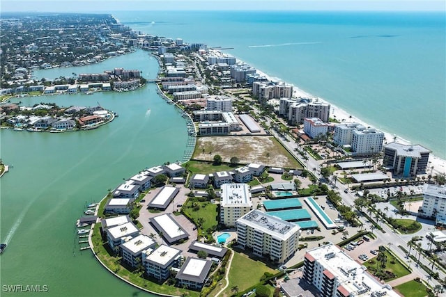birds eye view of property featuring a city view and a water view