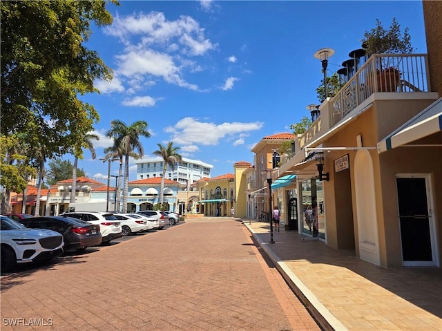exterior space featuring sidewalks and street lights