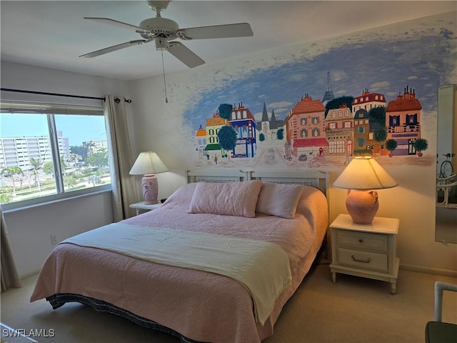 bedroom with a ceiling fan and carpet flooring