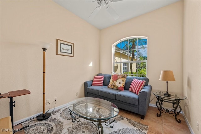 living room featuring light tile patterned floors, ceiling fan, and baseboards