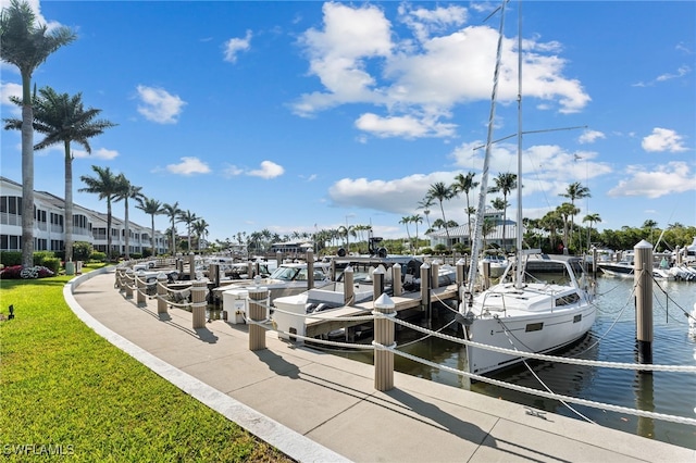 1749 Gulfstar Dr S Unit 404, Naples, FL 34112 - view of dock with a water view and a yard