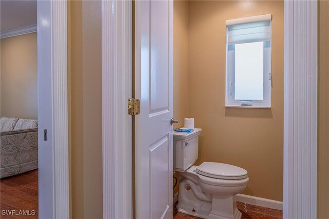 419 Pine Ave, Naples, FL 34108 - half bathroom with toilet and baseboards