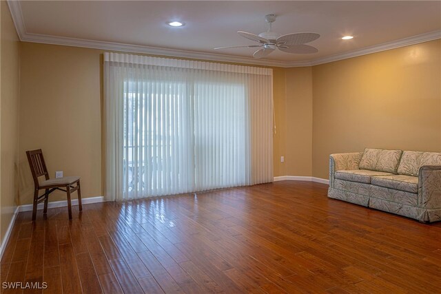 419 Pine Ave, Naples, FL 34108 - living room with dark wood-type flooring, crown molding, and a ceiling fan