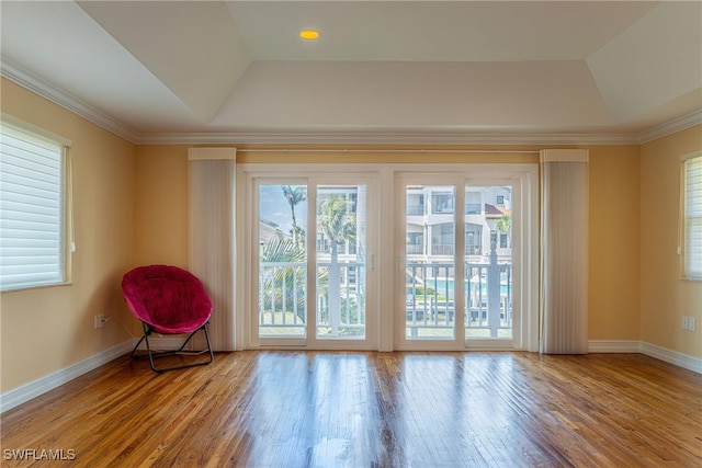 419 Pine Ave, Naples, FL 34108 - unfurnished room featuring a raised ceiling, wood finished floors, and baseboards