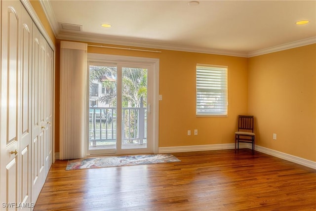 419 Pine Ave, Naples, FL 34108 - entryway featuring crown molding, baseboards, and wood finished floors