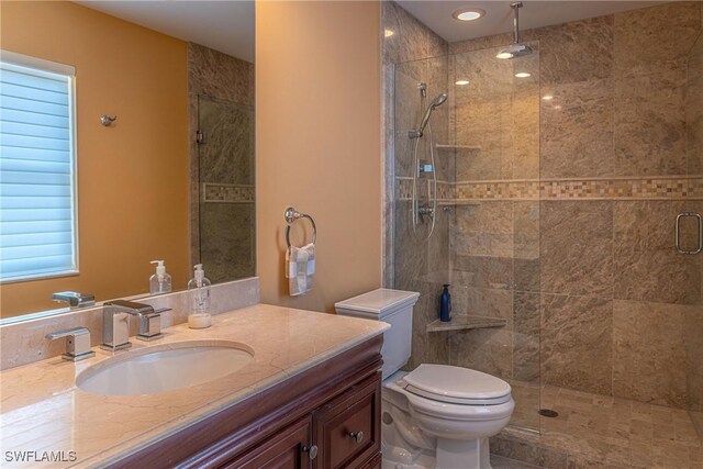 419 Pine Ave, Naples, FL 34108 - full bathroom featuring toilet, a stall shower, and vanity