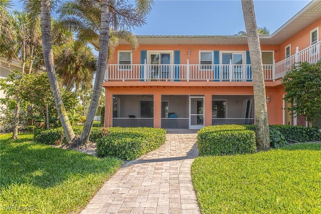 419 Pine Ave, Naples, FL 34108 - view of front of home with a front lawn and stucco siding