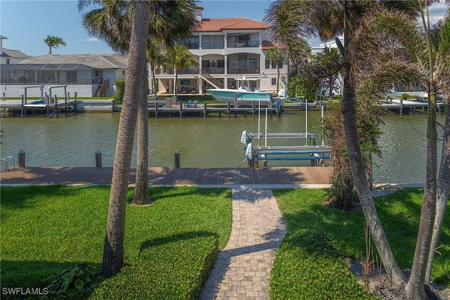 419 Pine Ave, Naples, FL 34108 - dock area with a water view, a residential view, a yard, and boat lift