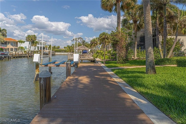 419 Pine Ave, Naples, FL 34108 - dock area featuring a water view, a yard, and boat lift