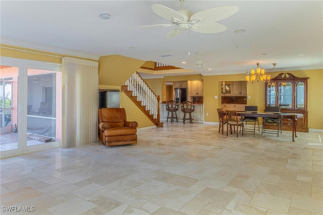 419 Pine Ave, Naples, FL 34108 - interior space featuring crown molding, ceiling fan with notable chandelier, baseboards, and stairs